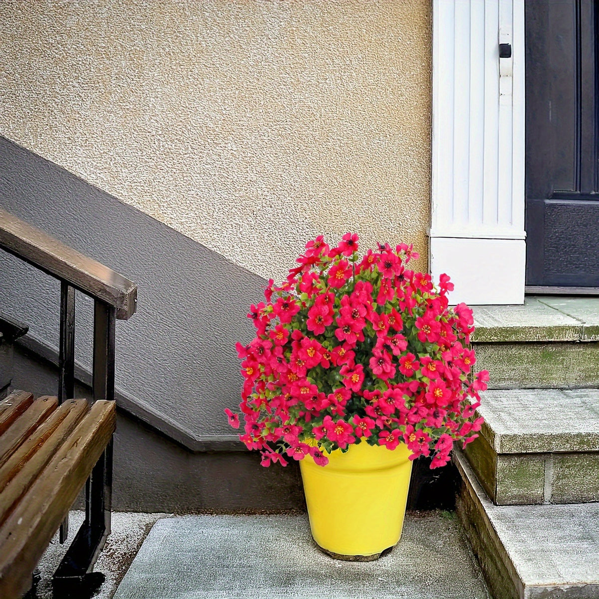Artificial flower stake displayed in a planter beside an outdoor porch