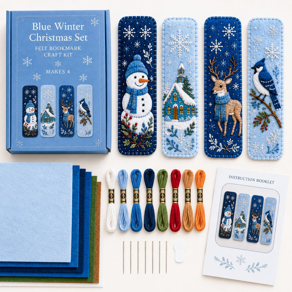 Blue winter bookmark materials arranged with felt thread and needles