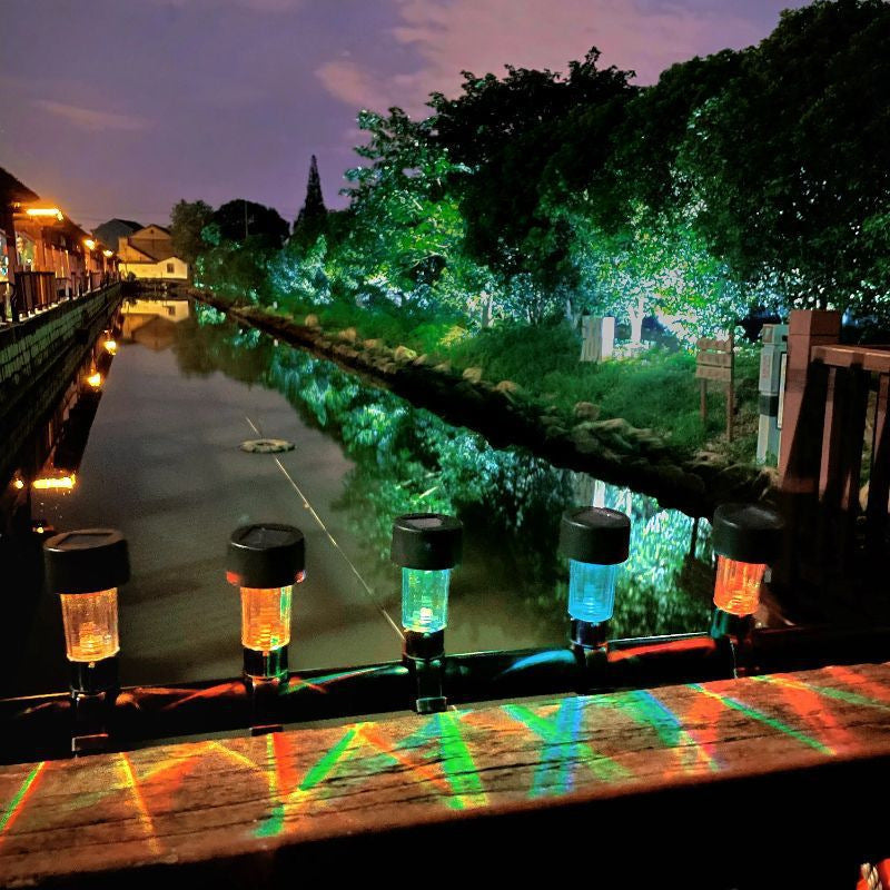 Colorful solar railing lights installed on outdoor railing at night