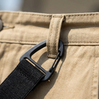 Close-up of men's belt loop suspenders hook attached to a pants belt loop