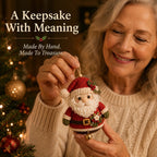 Woman crafting a Santa ornament beside a Christmas tree