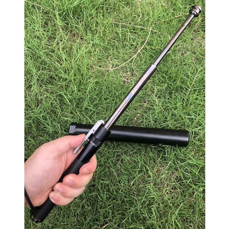 Telescoping stick fully extended while held outdoors