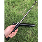 Telescoping stick fully extended while held outdoors
