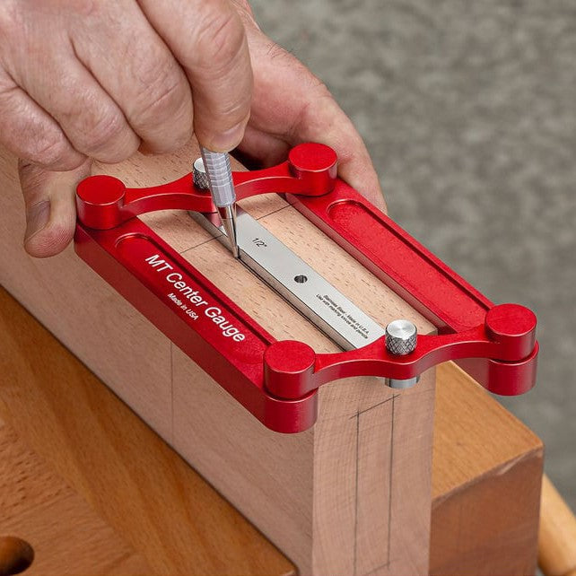 Woodworking center marking gauge used to mark the center line on a wooden board
